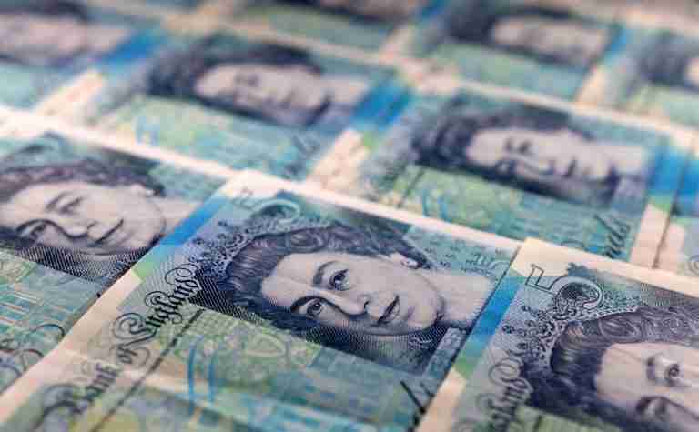 Sterling edges lower versus dollar, eyes on military spending