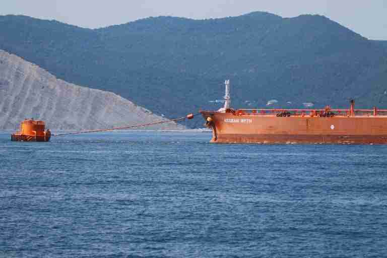 Oil hits 4-year low, coffee falls as trade war escalates