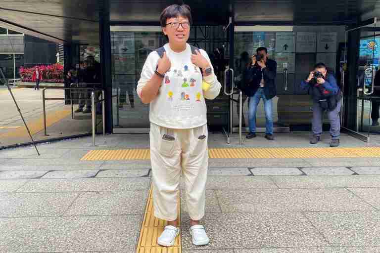 After retrial, Hong Kong court jails social worker to nearly 4 years for rioting