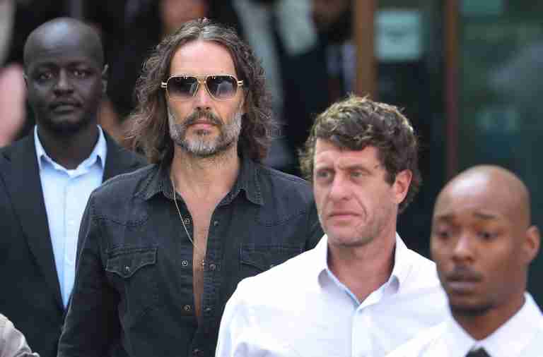 Comedian Russell Brand appears in UK court over rape and sex assault charges