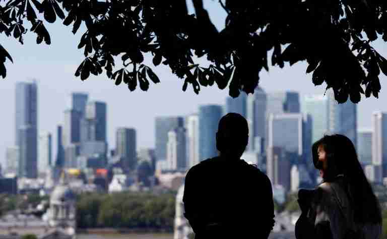 UK business downturn eases despite worsening factory woes, PMI shows