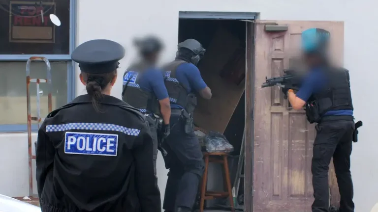 Armed police search properties on Court Street