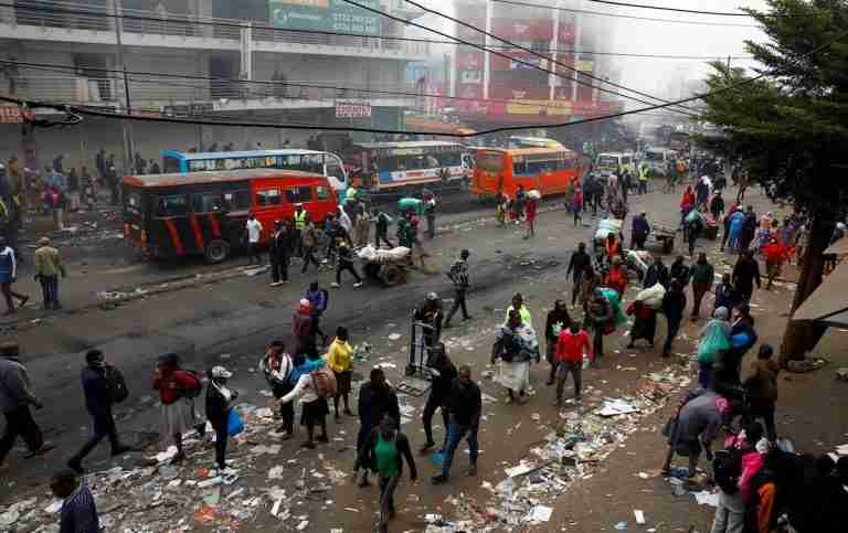 Kenyans clean up looted shops, torched buildings after day of deadly protests