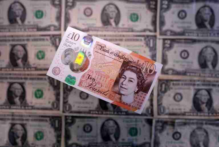 Sterling climbs versus dollar, on track for weekly rise