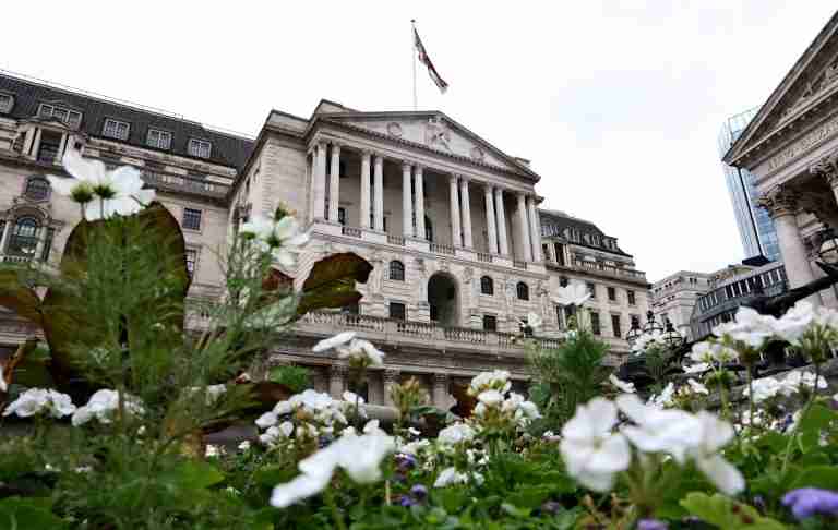 Bank of England slows pace of bond rundown, keeps rates steady