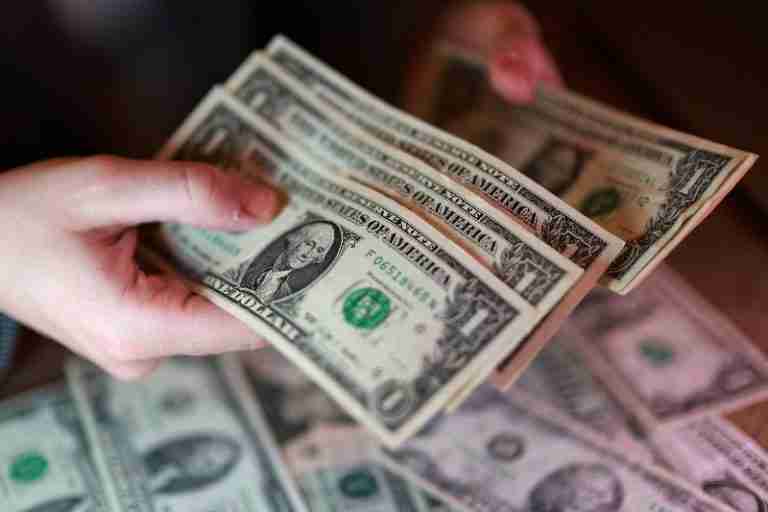 Dollar dips; rising oil and bond yields temper losses