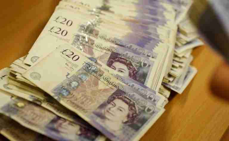 Sterling slips after UK jobs data, politics in focus