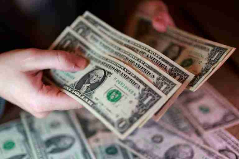 Dollar in tight range as traders eye Middle East peace talks