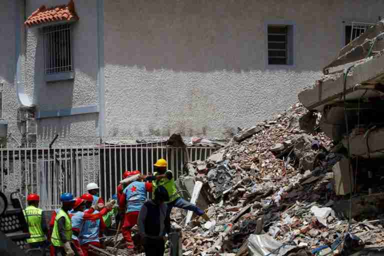 Venezuelans race to find survivors, foreign rescuers join search as frustration mounts