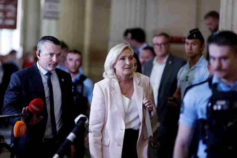 French court clears Marine Le Pen to run for president, with ankle tag