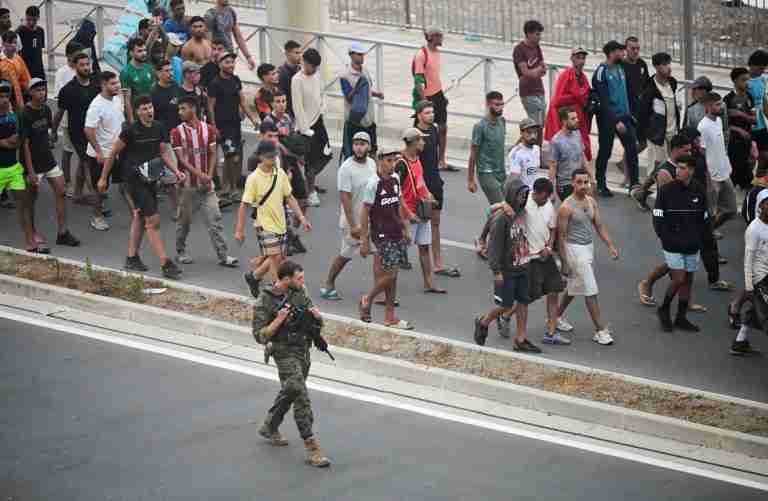 Spain says migrants are returning from Ceuta after 57 die in border rush