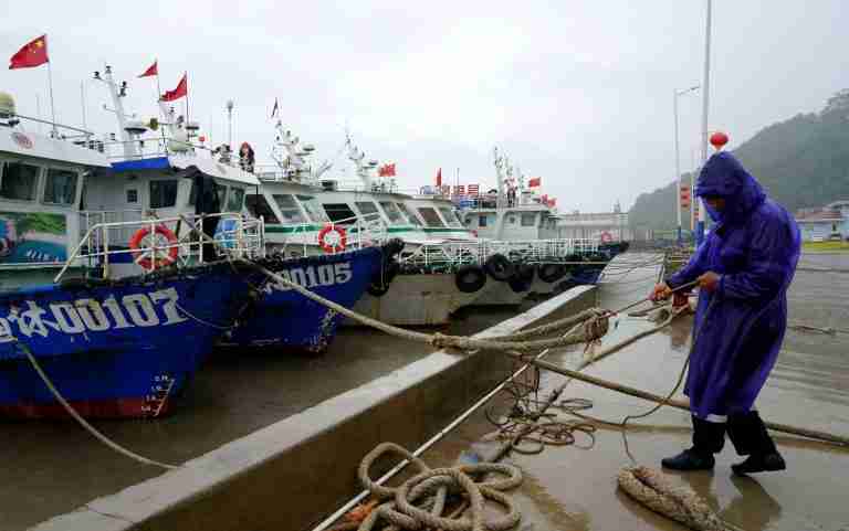 Heavy rains drench Beijing as China braces for Typhoon Dolphin