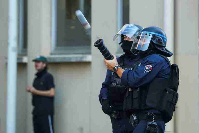 France suspends use of stun grenades to police student protests