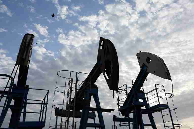 Oil slips from five-month high with Hormuz transits in focus